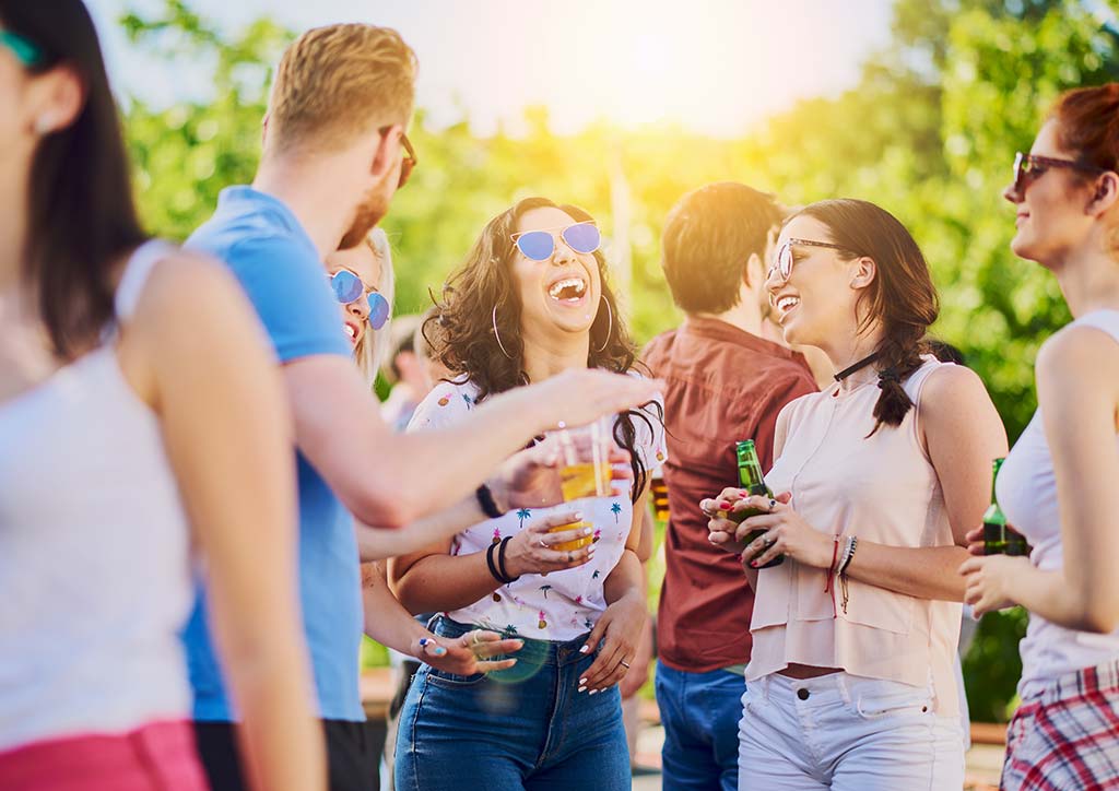Coachella and Stagecoach Man and women drinking at a music festival