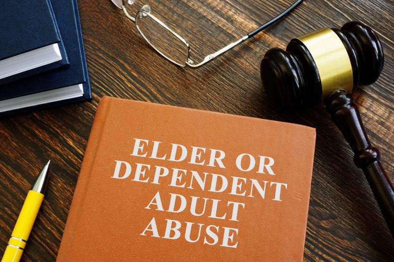 Elder or dependent adult abuse book and gavel. Elder Abuse